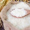 depositphotos 35524067 stock photo wooden spoon with raw rice