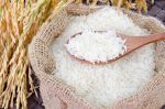 depositphotos 35524067 stock photo wooden spoon with raw rice